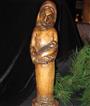 A wood carving Creche (Nativity Scene) from Zimbabwe that shows Mary cradling the Christ child in her arms.